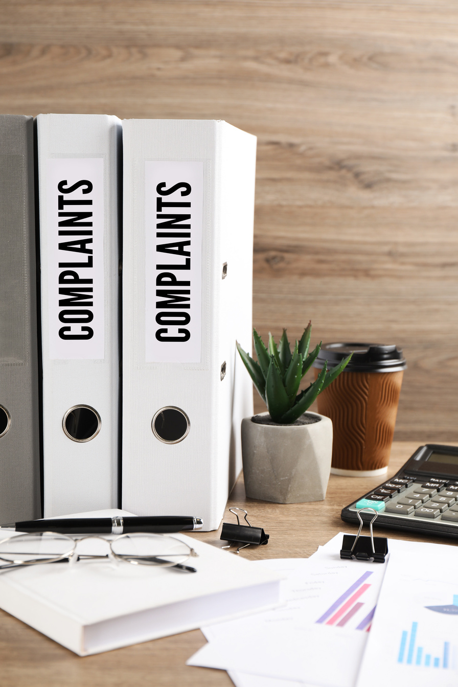 complaints folders on a desk