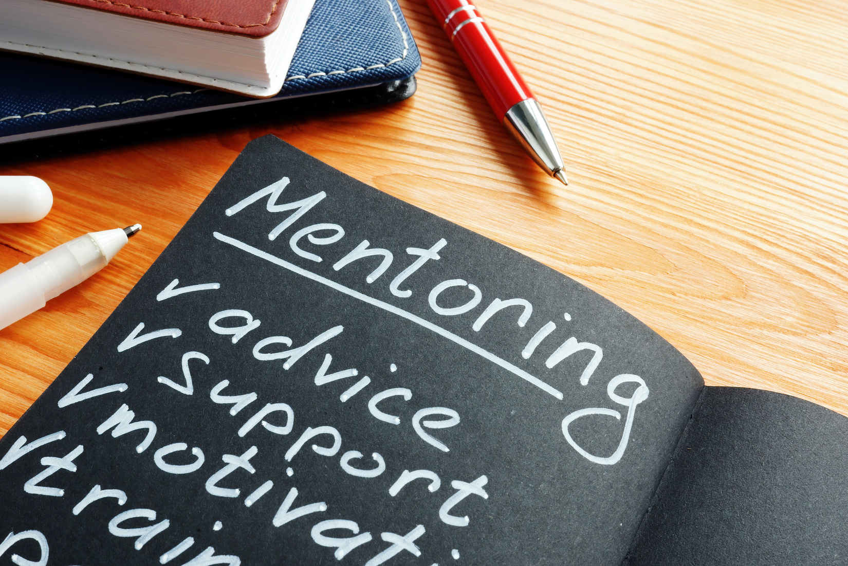 a chalkboard with the heading 'mentoring'