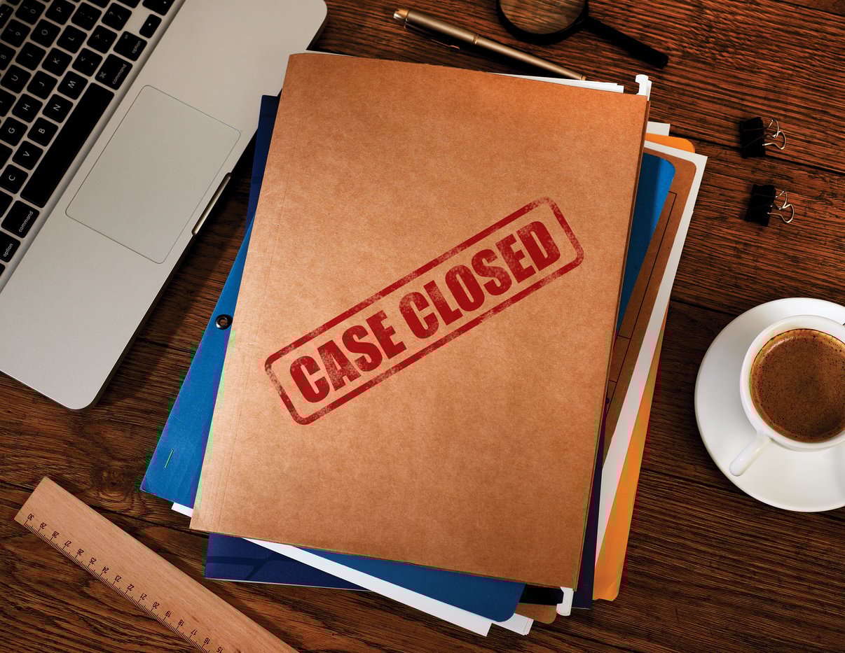 a folder with 'case closed' stamped on the cover